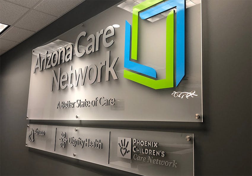 A beautiful layered and engraved plastic entryway sign made for Arizona Care Network